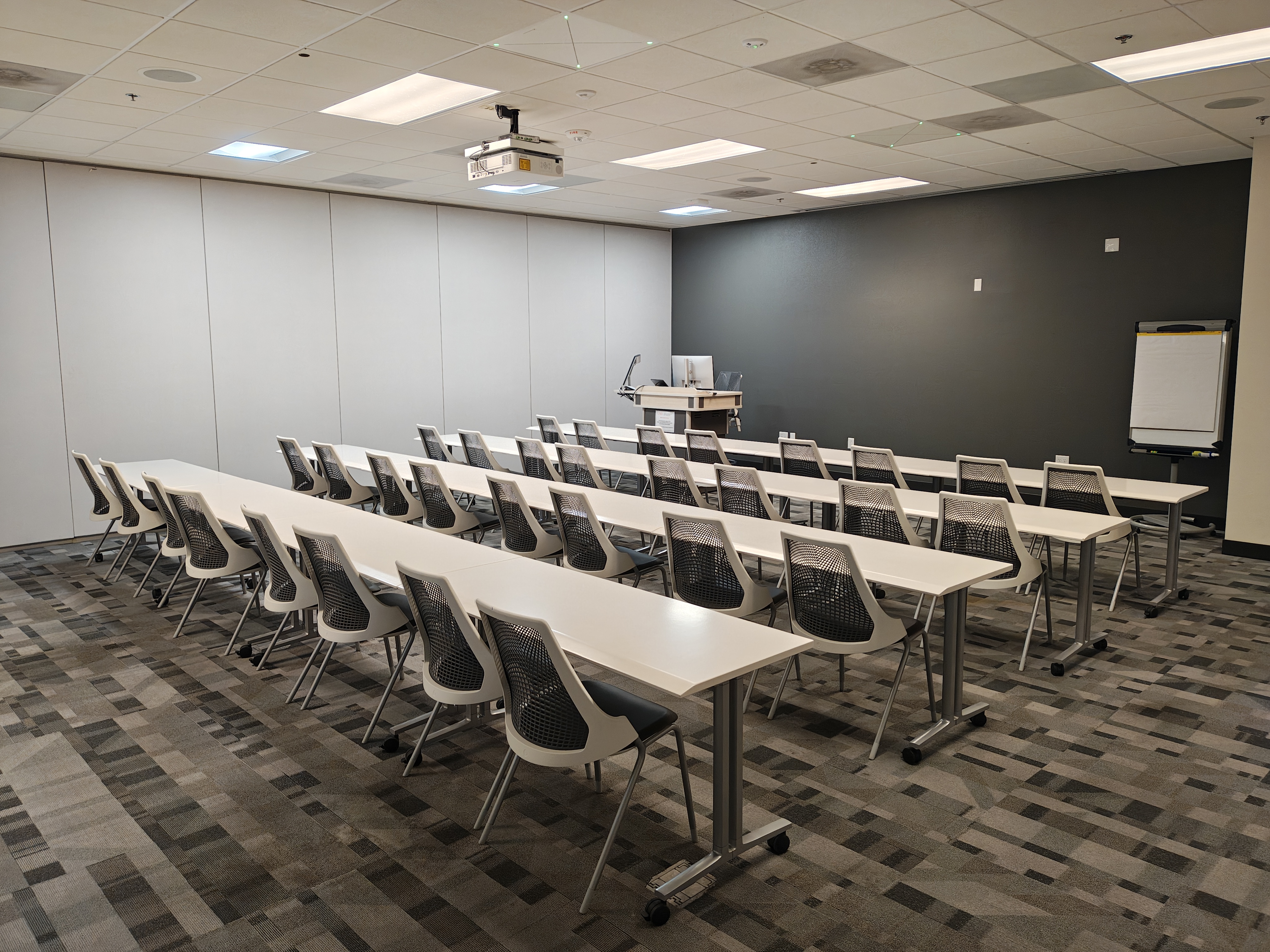 MAB@ 139 Classroom photo with tables and empty chairs
